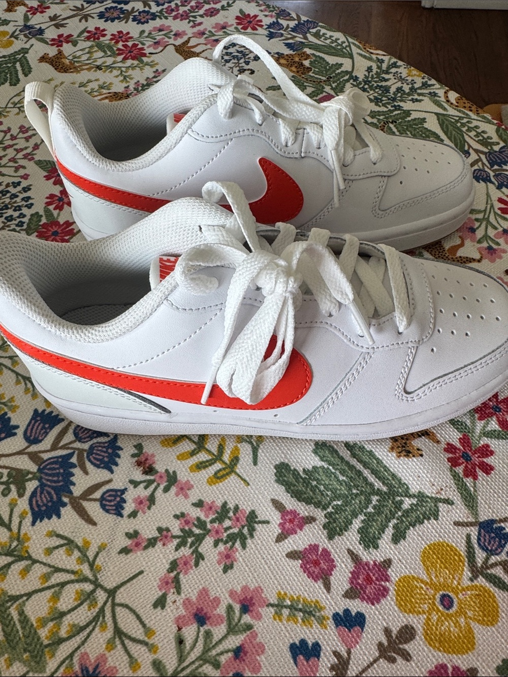 Nike Kids White Sneakers with Orange Swoosh